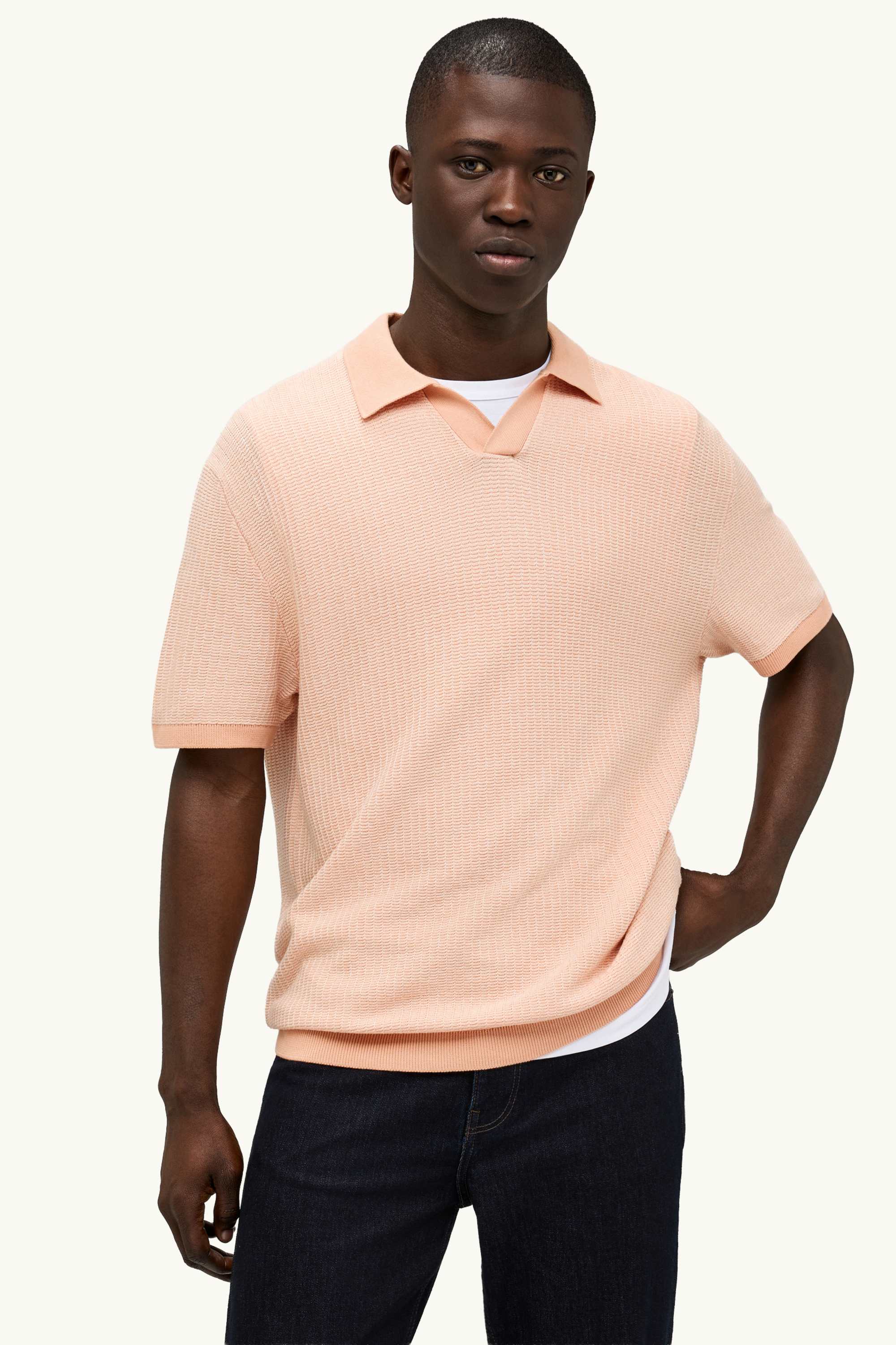 Knitted polo shirt - relaxed fit - textured orange