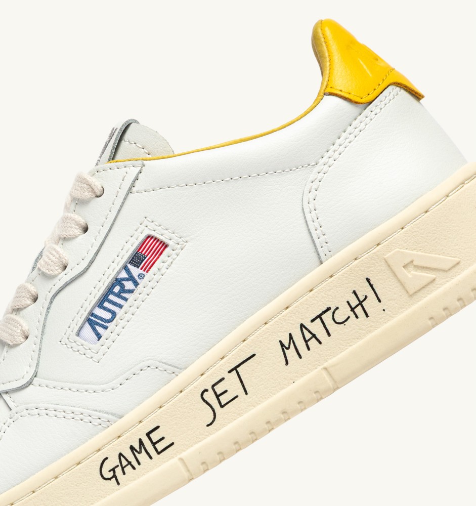 MEDALIST LOW IN WHITE AND SLICKER LEATHER WITH LETTERING