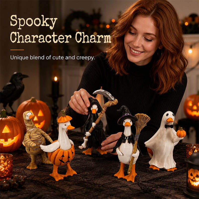 Halloween duck figurines arranged on a decorated table