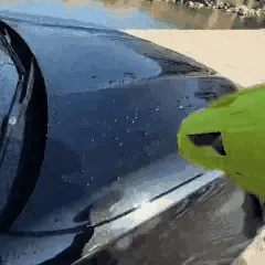 Blowing water from a car surface