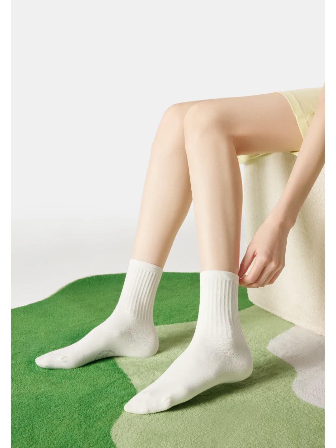 Pure white mid-calf cotton socks with a wide-ribbed design.
