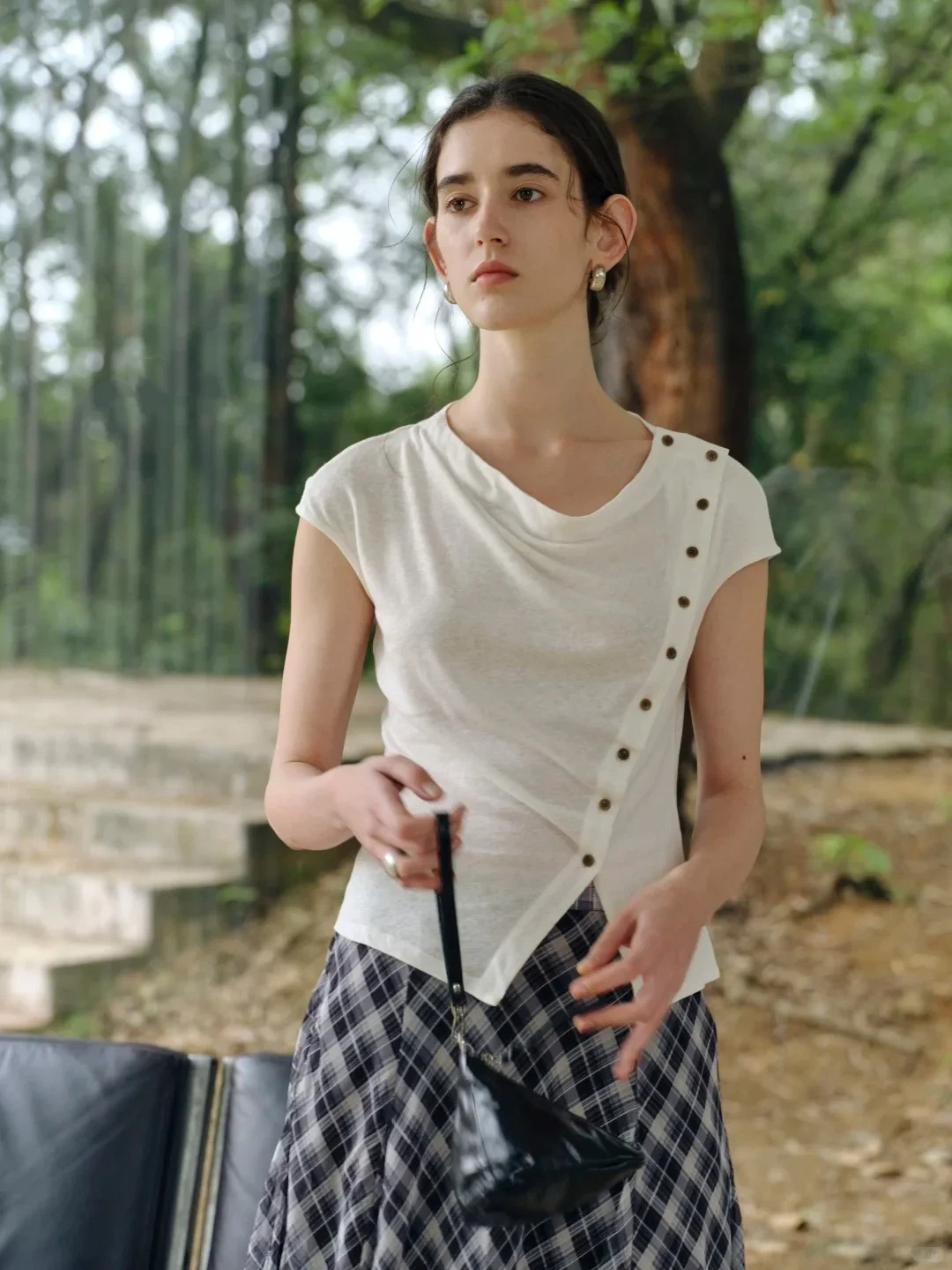White cotton-linen top with irregular buttons