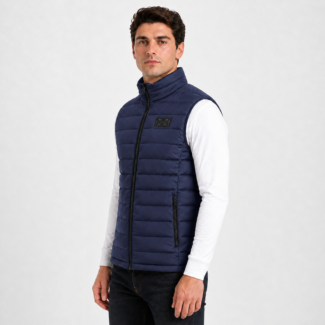 Side view of a male model wearing the blue heated vest.