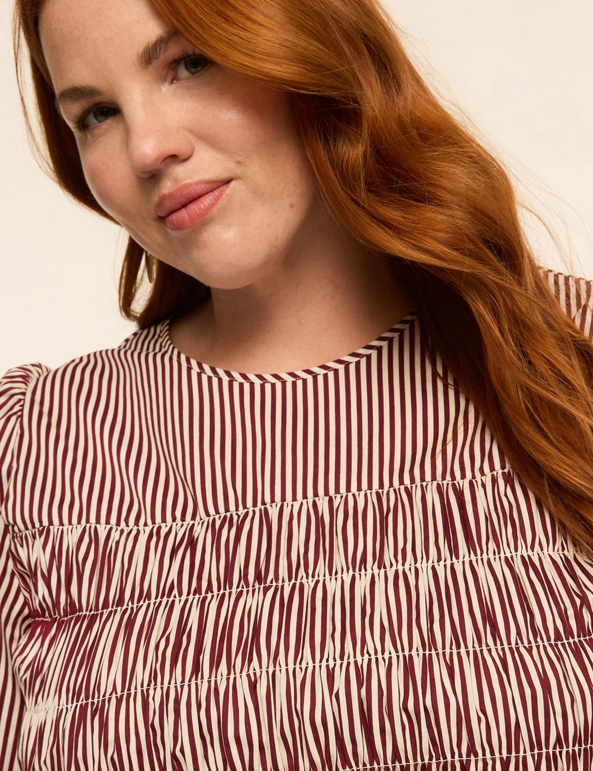 Puff-Sleeve Smocked Peplum Top