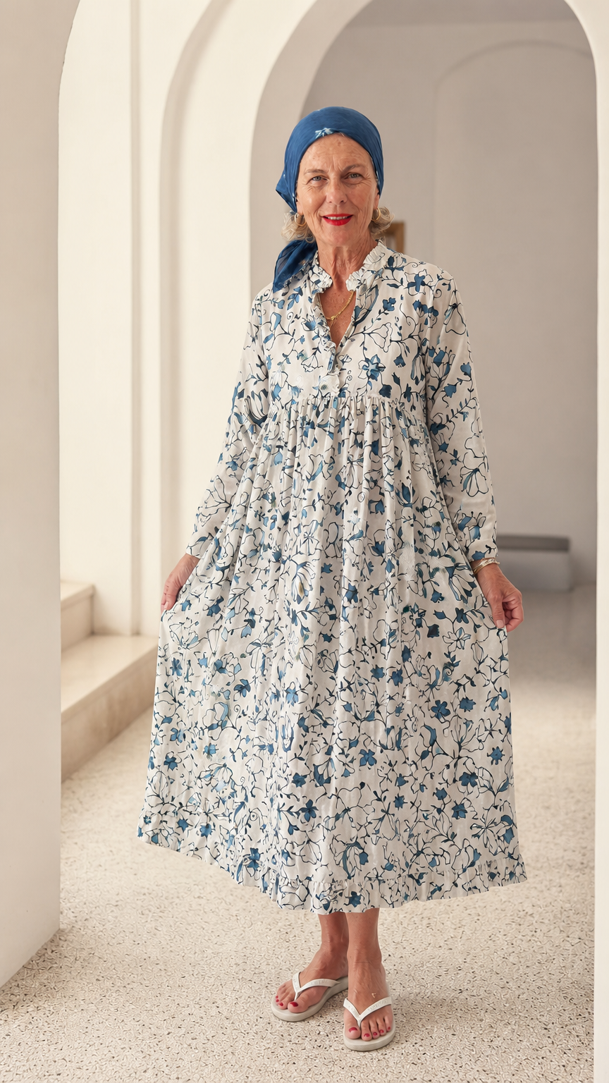 Front full-length view of woman wearing Blue & White floral long sleeve ruffle collar midi dress