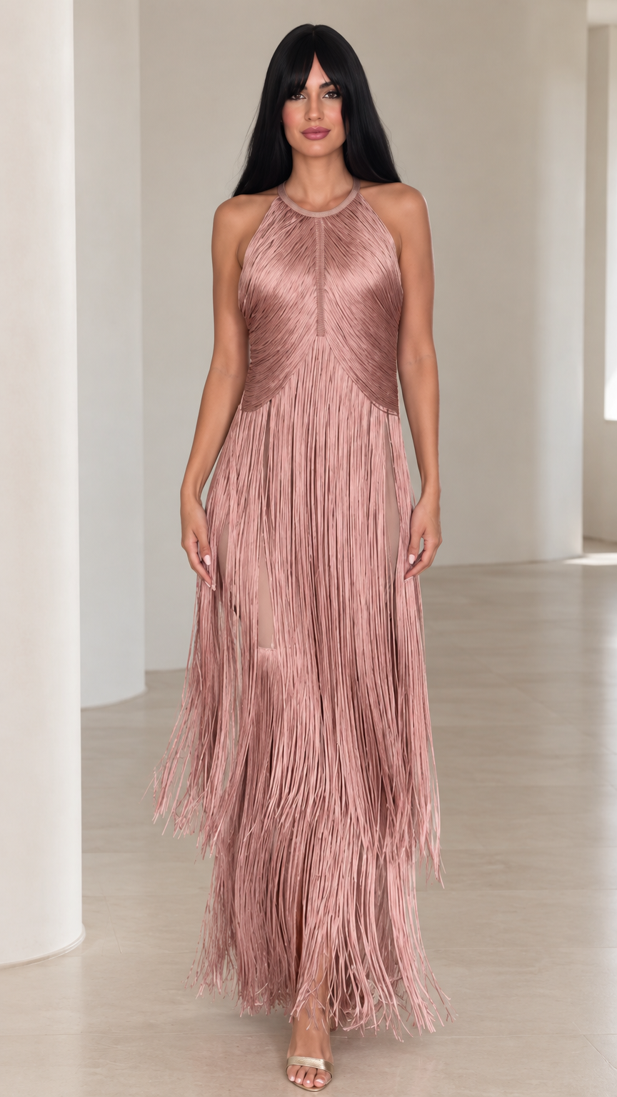 Front view of woman wearing dusty rose halter neck tiered fringe maxi dress