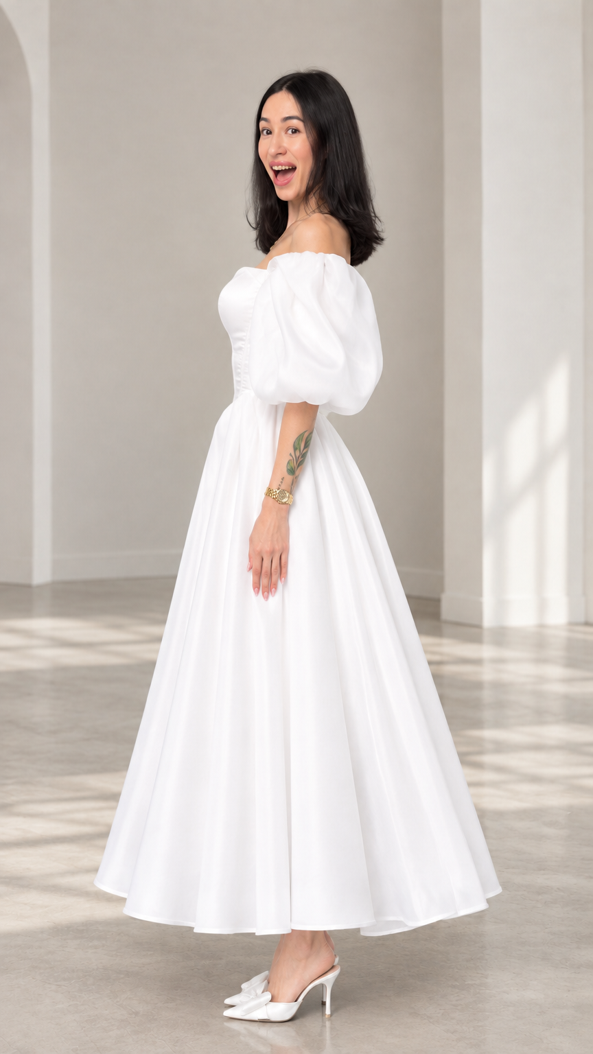 Side profile view of a woman wearing a white corset-bodice tea-length evening dress