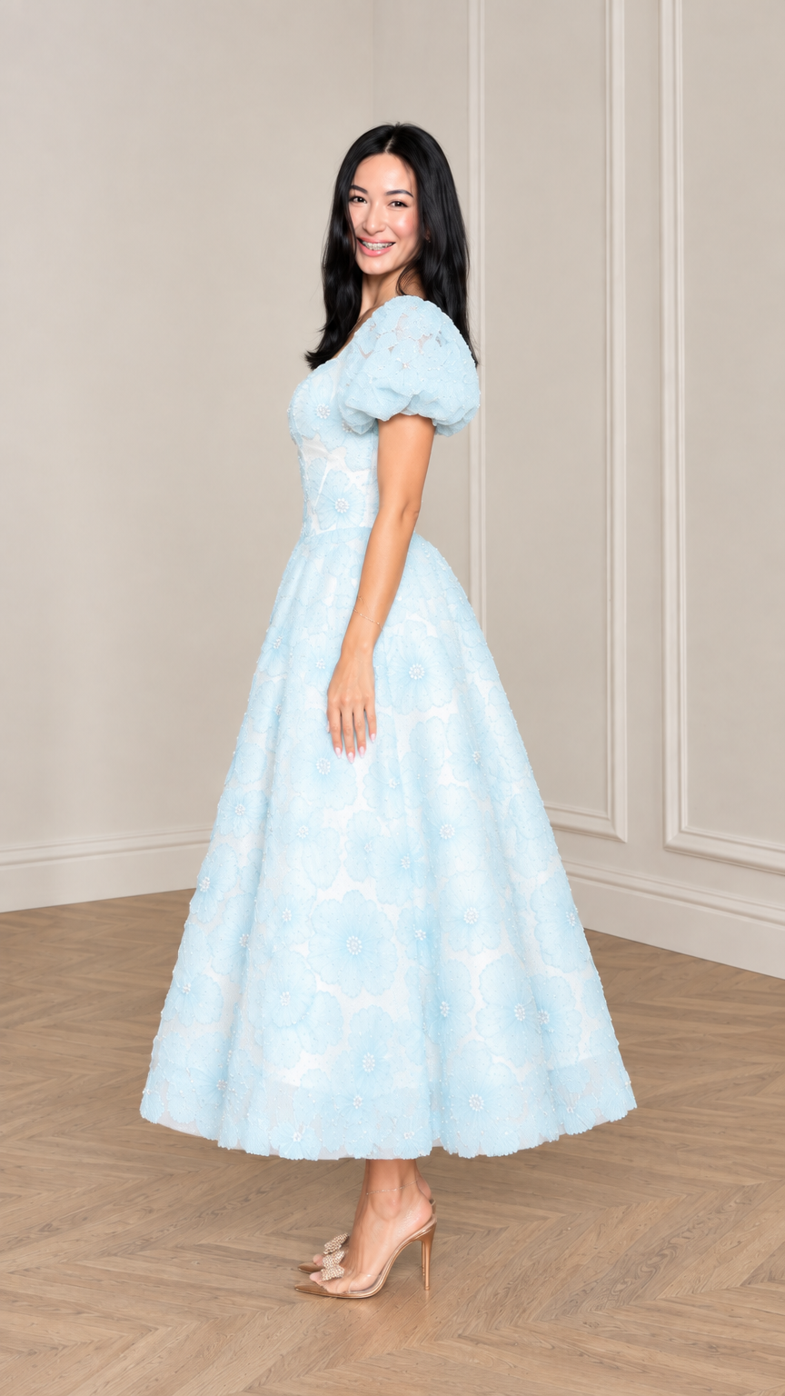 Side profile view of woman modeling Light Blue floral applique midi dress