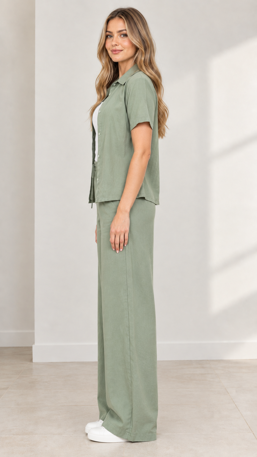 Side angle view of model wearing Sage Green casual two-piece pant set