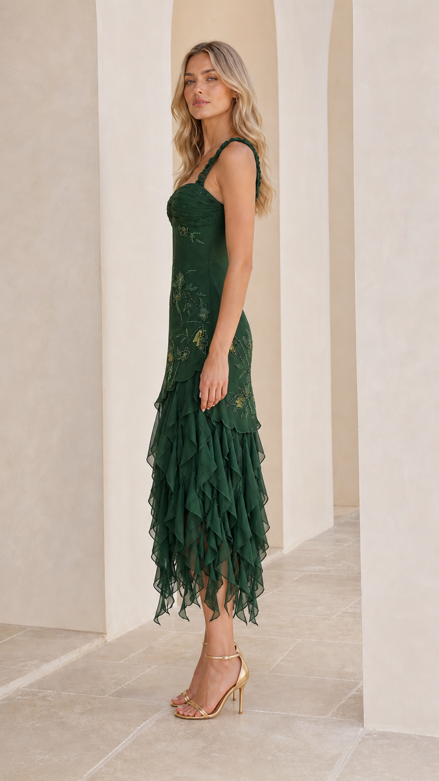 Side view of emerald green embroidered ruffle midi dress
