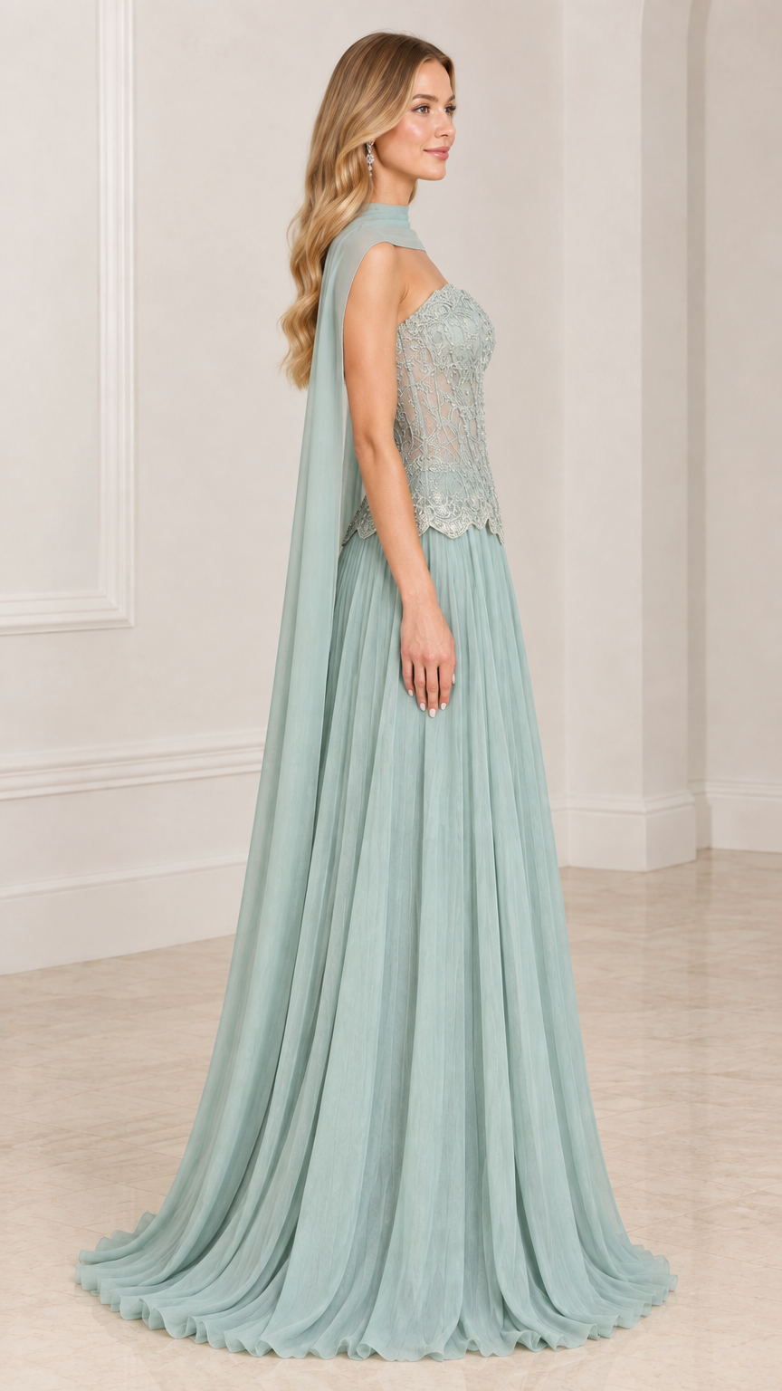 Side profile of model wearing sage green pleated chiffon formal gown with lace bodice and back cape
