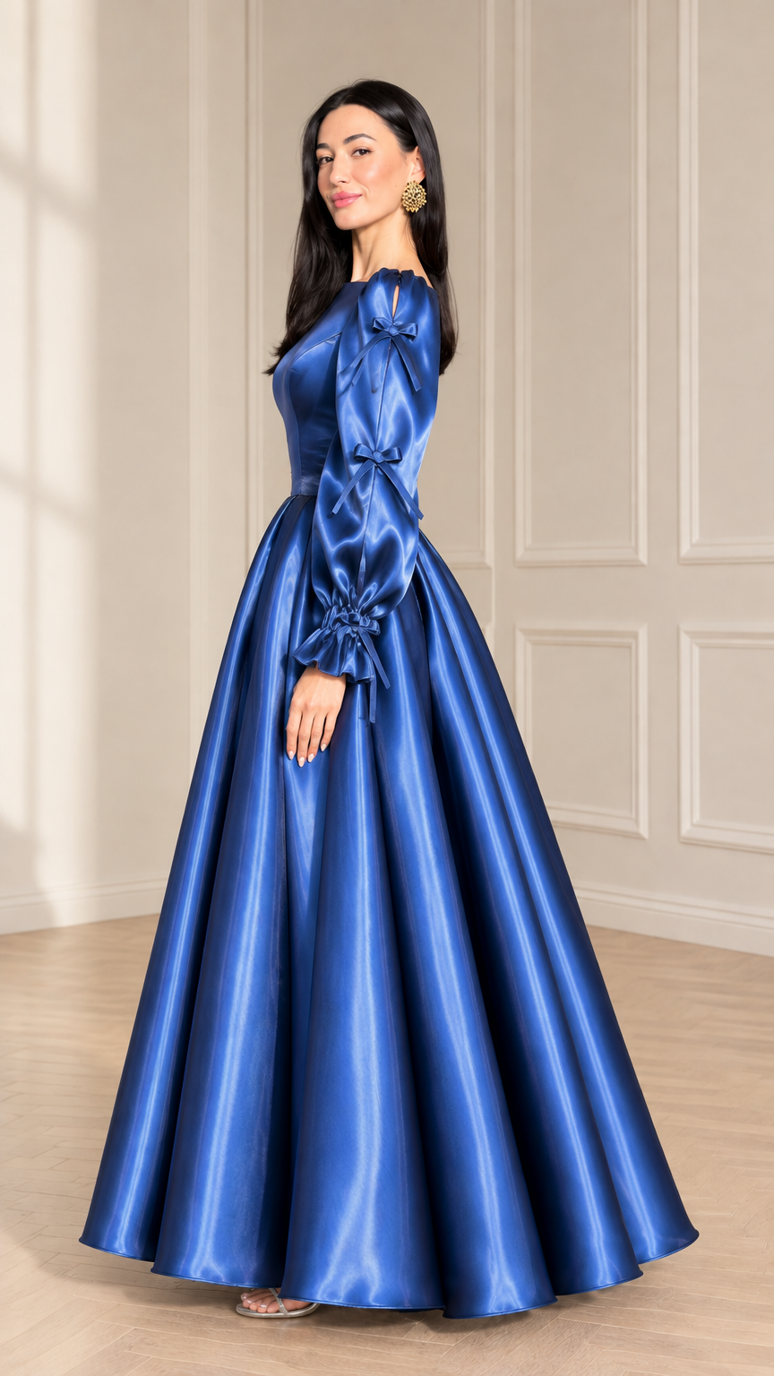 Side profile of woman wearing royal blue satin evening gown with full flared skirt