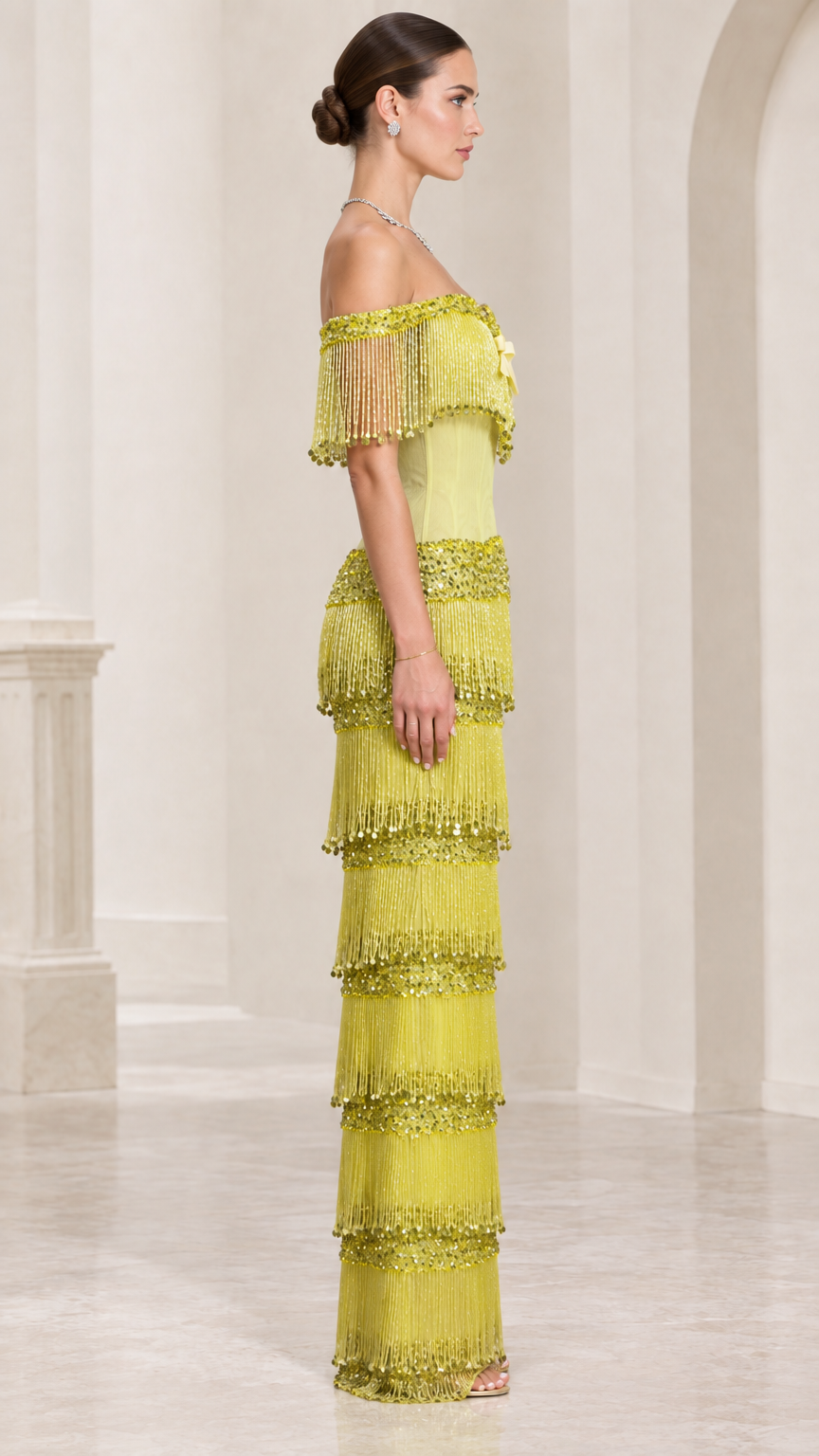 Side profile of chartreuse off-shoulder tiered fringe maxi dress