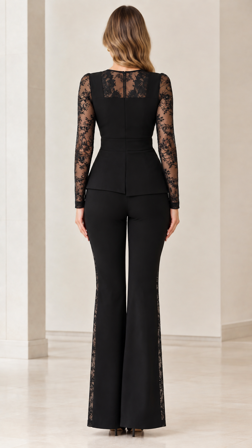 Back view of black two-piece pant suit highlighting sheer lace upper back