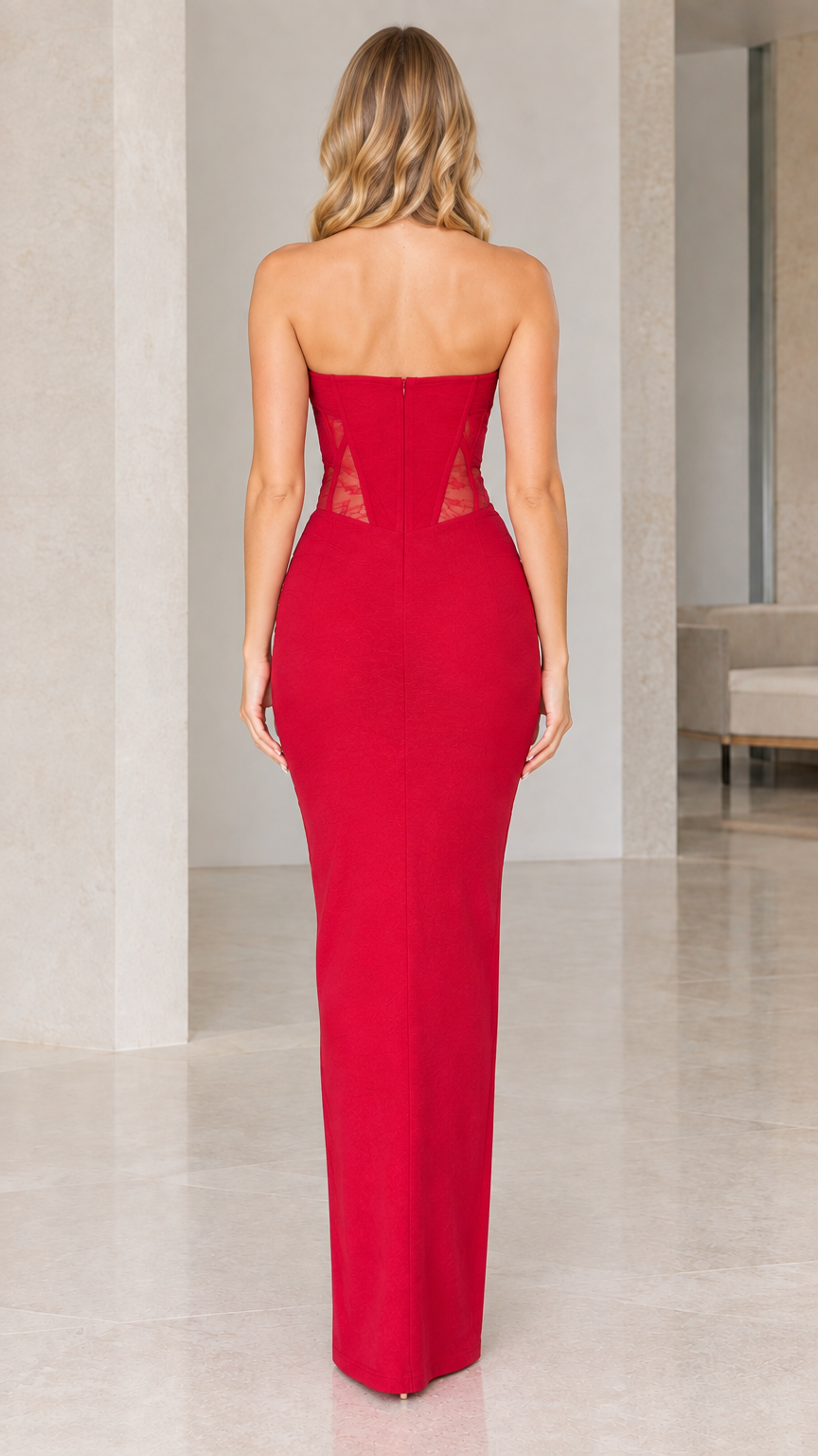 Back view of model wearing full-length red strapless corset gown