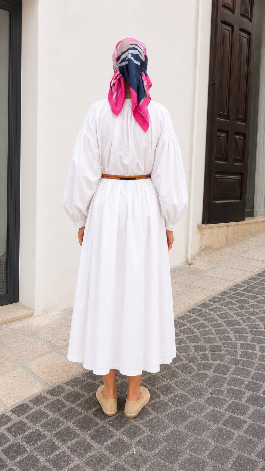 Back view of white gathered midi dress with voluminous sleeves