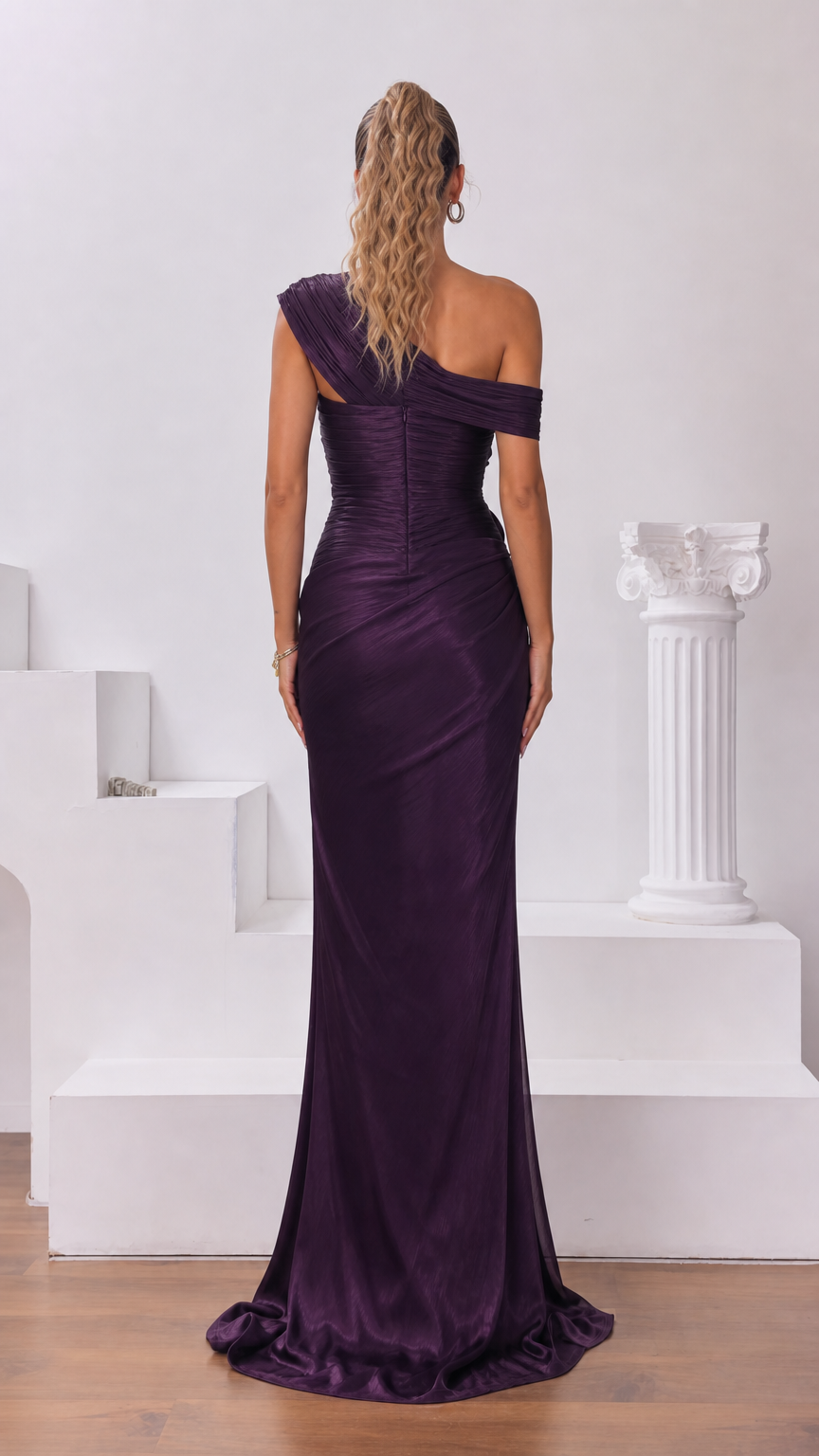 Back view of woman wearing Plum Purple one-shoulder maxi dress with subtle train