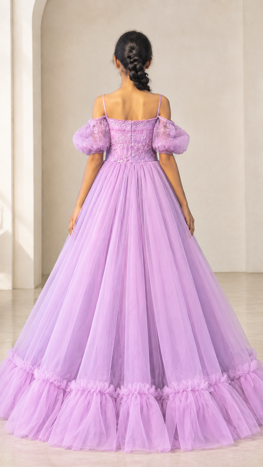 Back view of lavender tulle gown featuring thin straps and back zipper closure