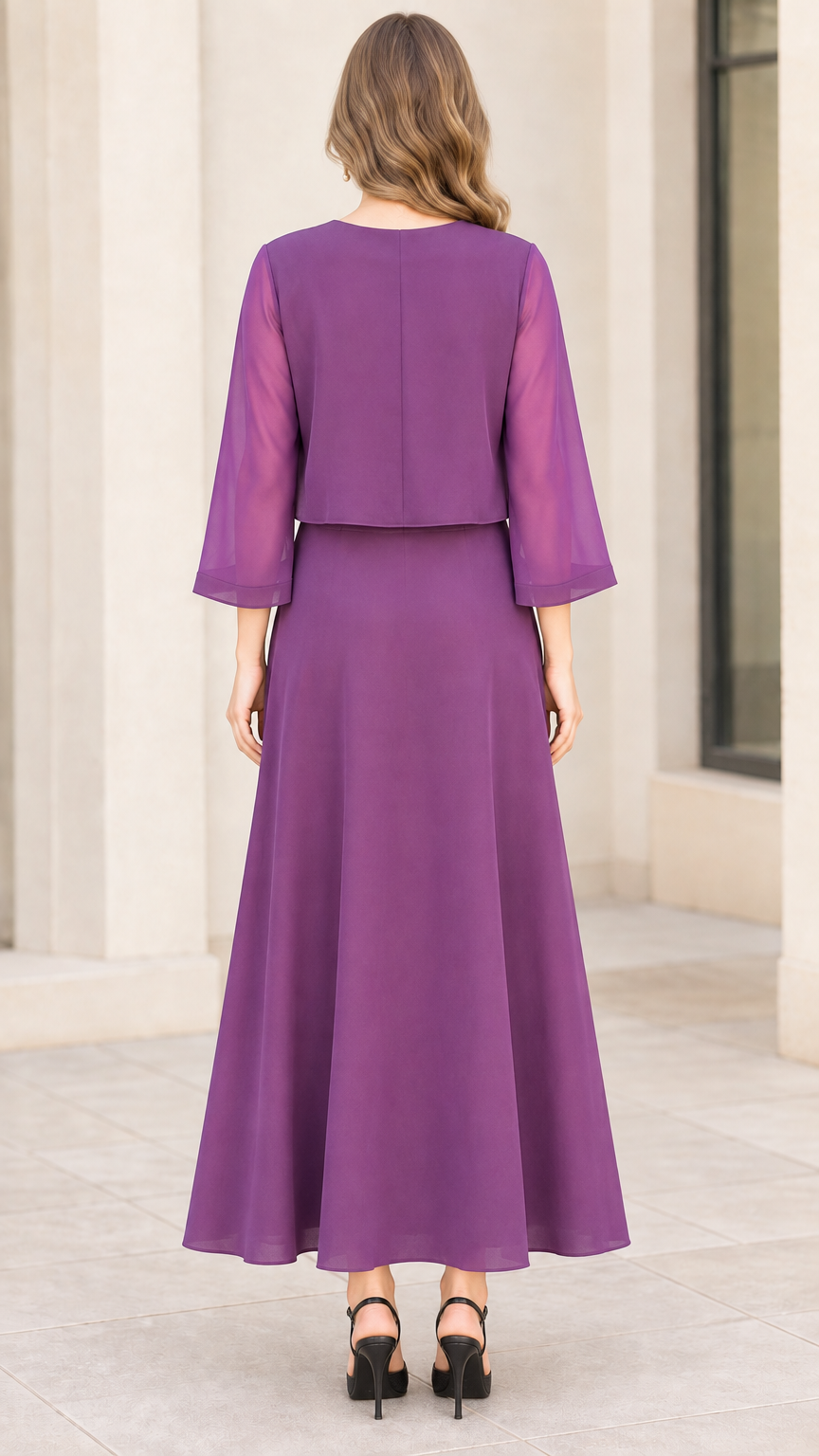 Back view of woman wearing purple maxi chiffon dress with sheer jacket overlay