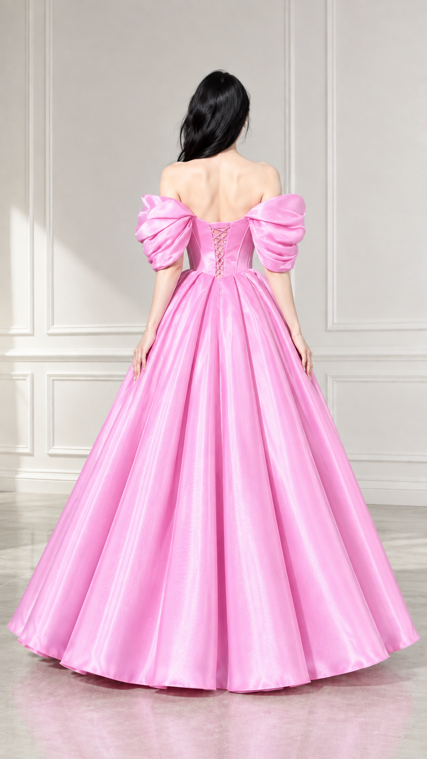 Back view of woman showing pink corset ball gown with lace-up back closure