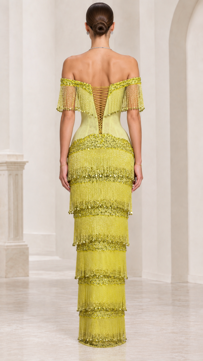 Back view of chartreuse fringe evening gown highlighting lace-up corset detail