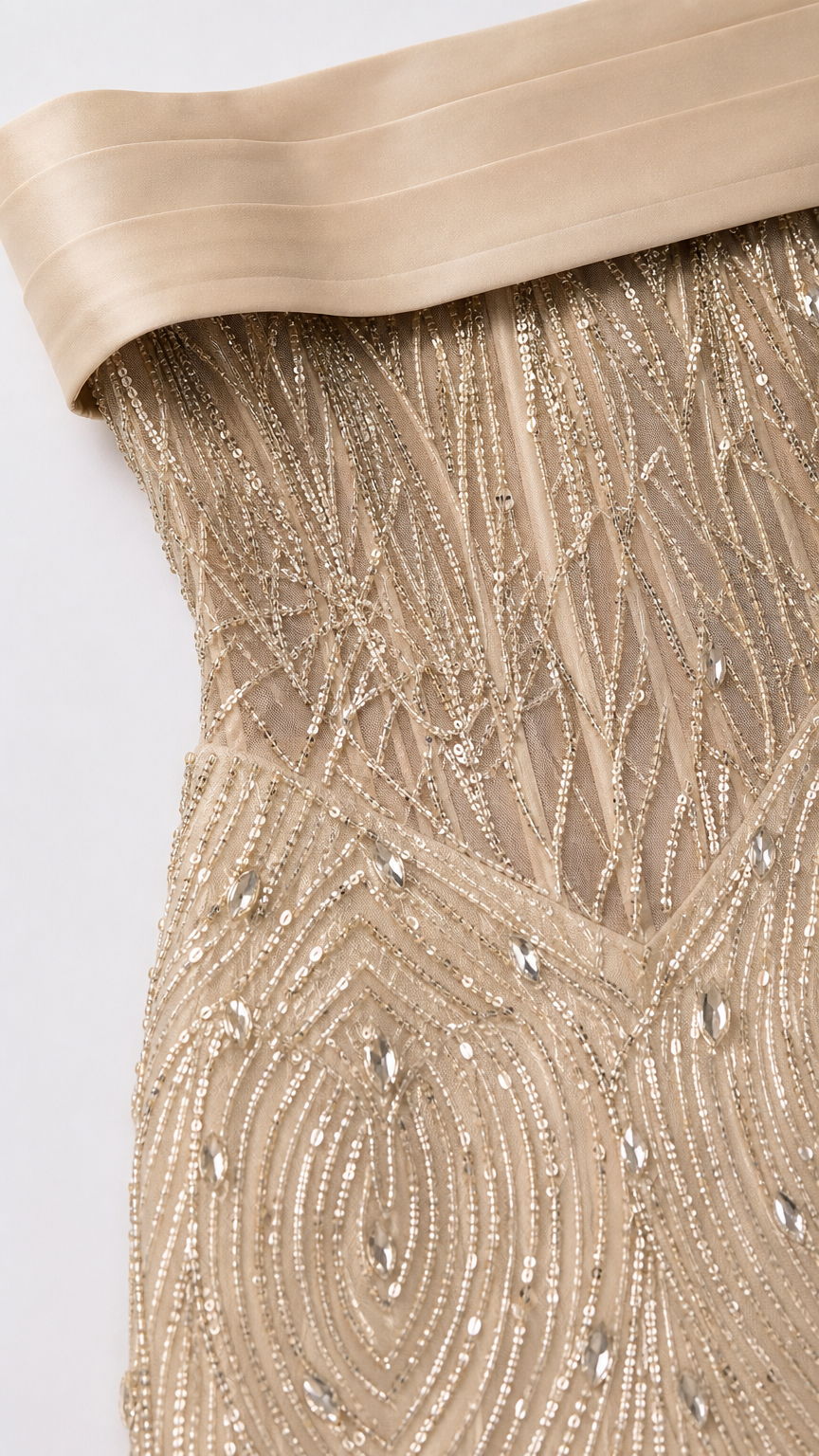 Close-up detail of bodice showing structured boning, intricate beadwork, and satin foldover neckline