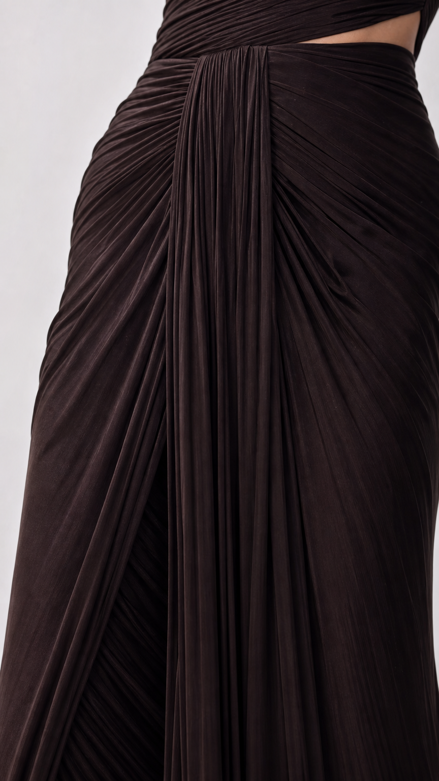 Close-up detail of dark brown ruched pleated waistband and gathered draping