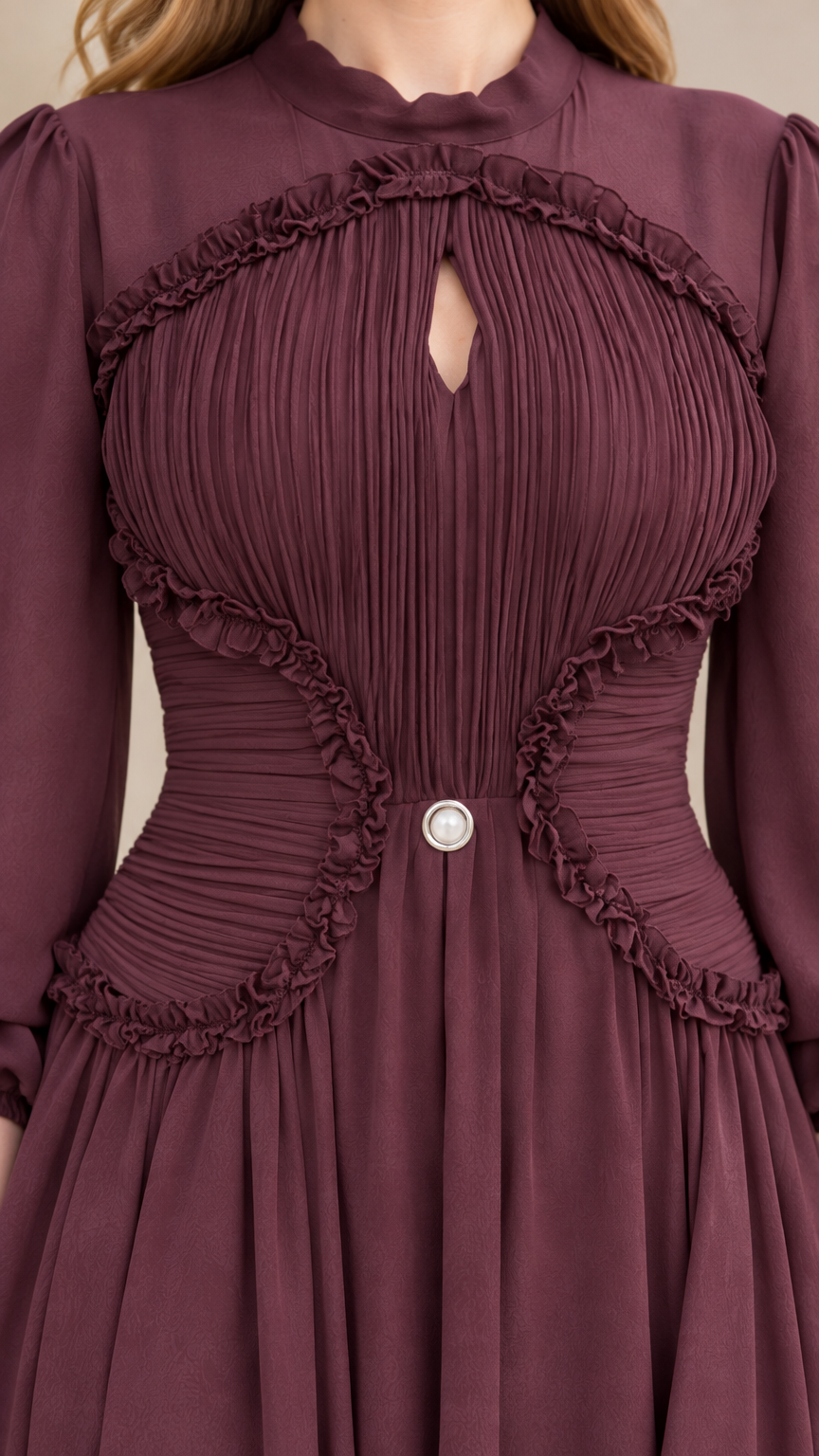 Close-up detail of pleated bodice with ruffle trim and keyhole cutout