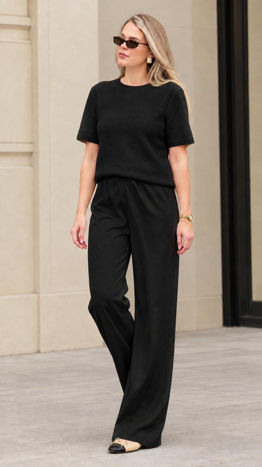 Women's black textured knit short sleeve top and wide leg pants matching set
