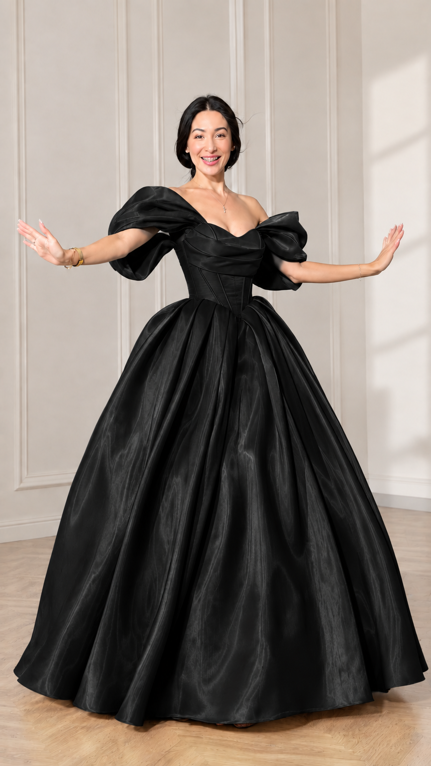 Front view of model wearing a black off-shoulder puff sleeve corset ball gown