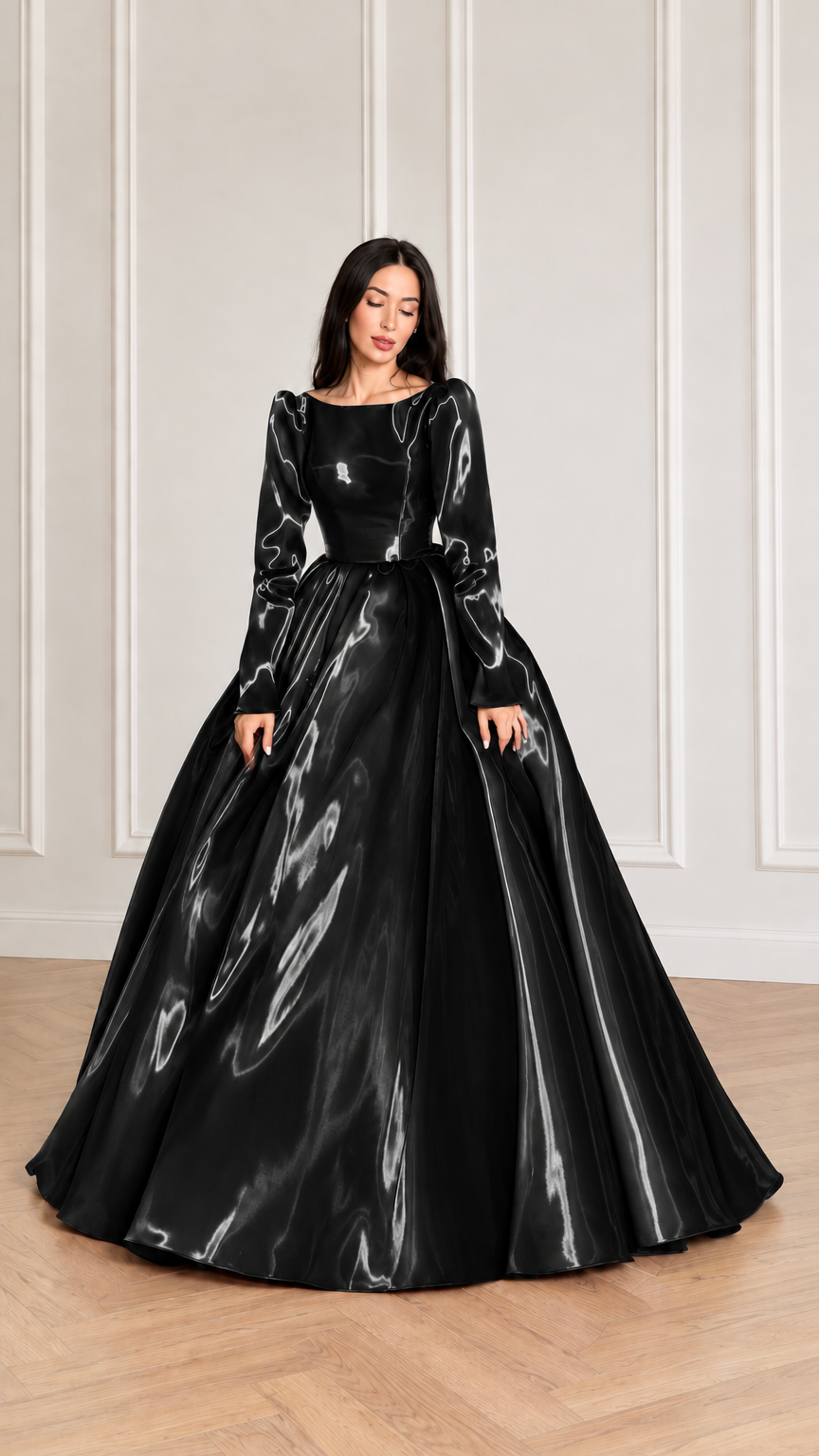 Front view of model wearing black glossy long sleeve satin ball gown