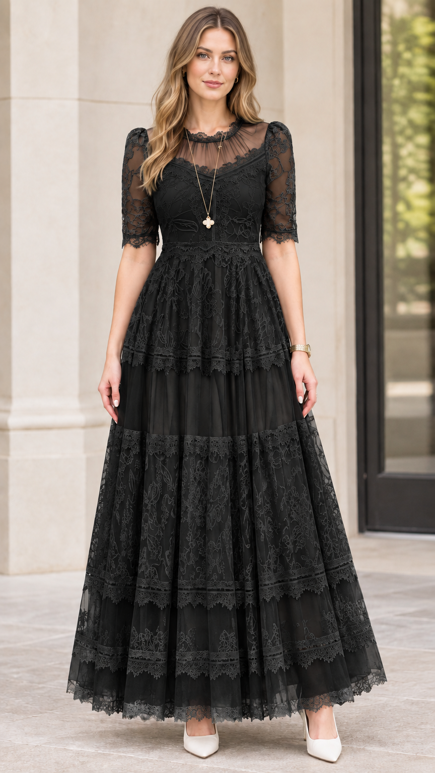 Front view of black tiered floral lace maxi dress with illusion neckline