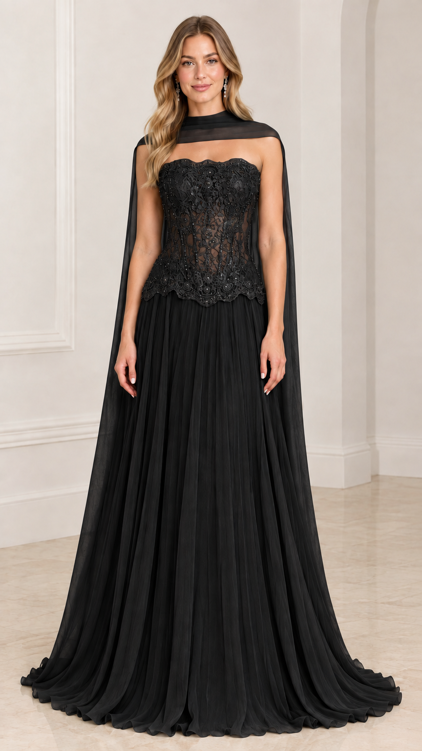 Front view of model wearing black strapless lace corset evening gown with sheer chiffon cape