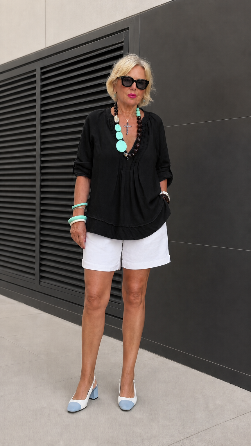 Model wearing Black pleated split neck tunic blouse