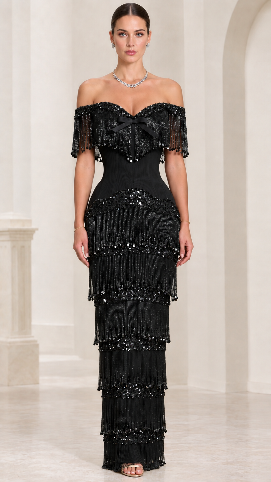 Model wearing black off-shoulder tiered fringe sequin formal gown