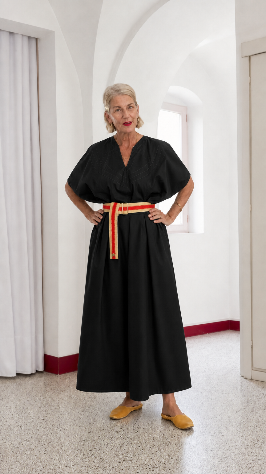 Front view of woman wearing black V-neck belted kimono maxi dress