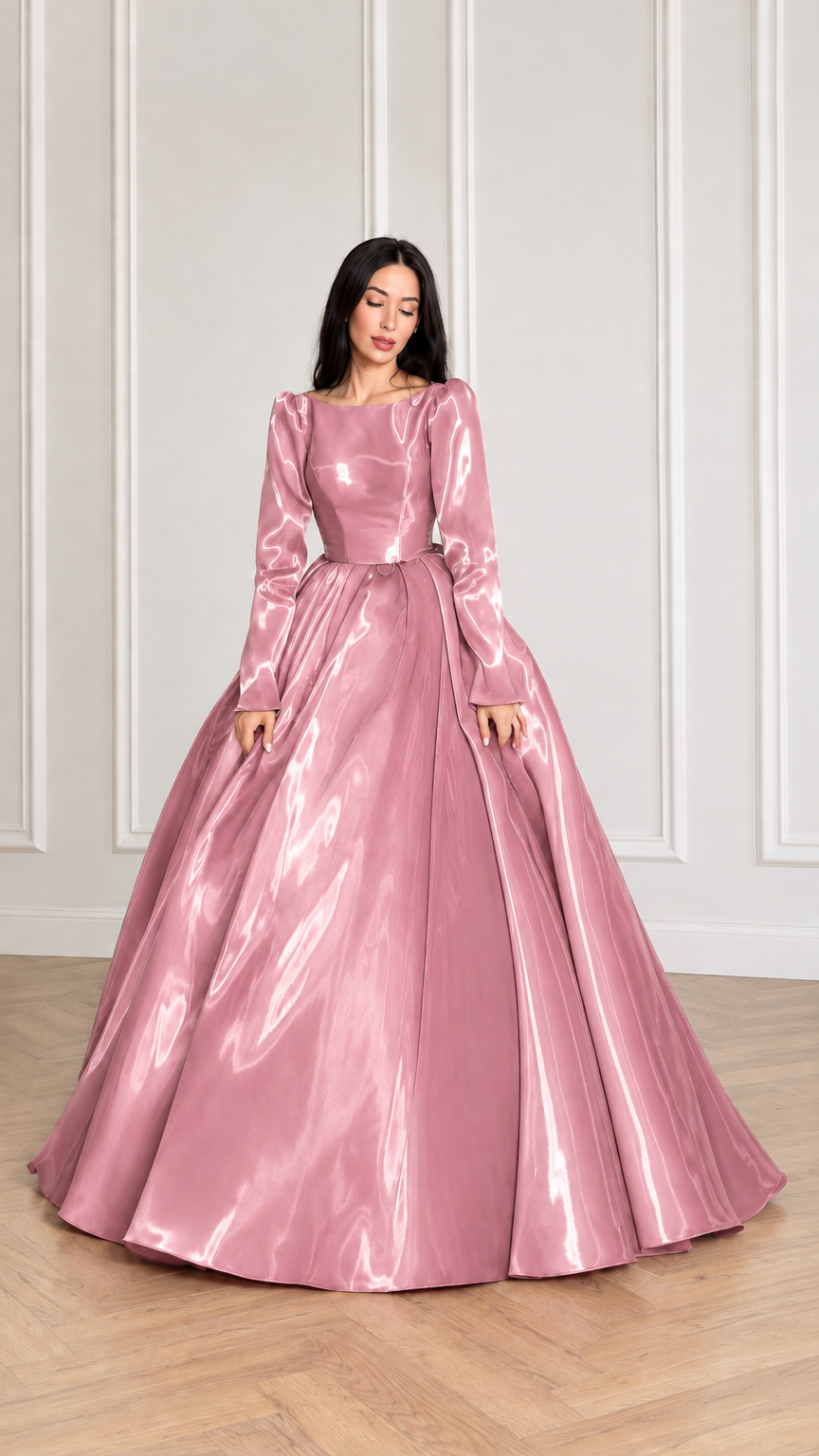 Front view of model wearing blush pink glossy long sleeve satin ball gown