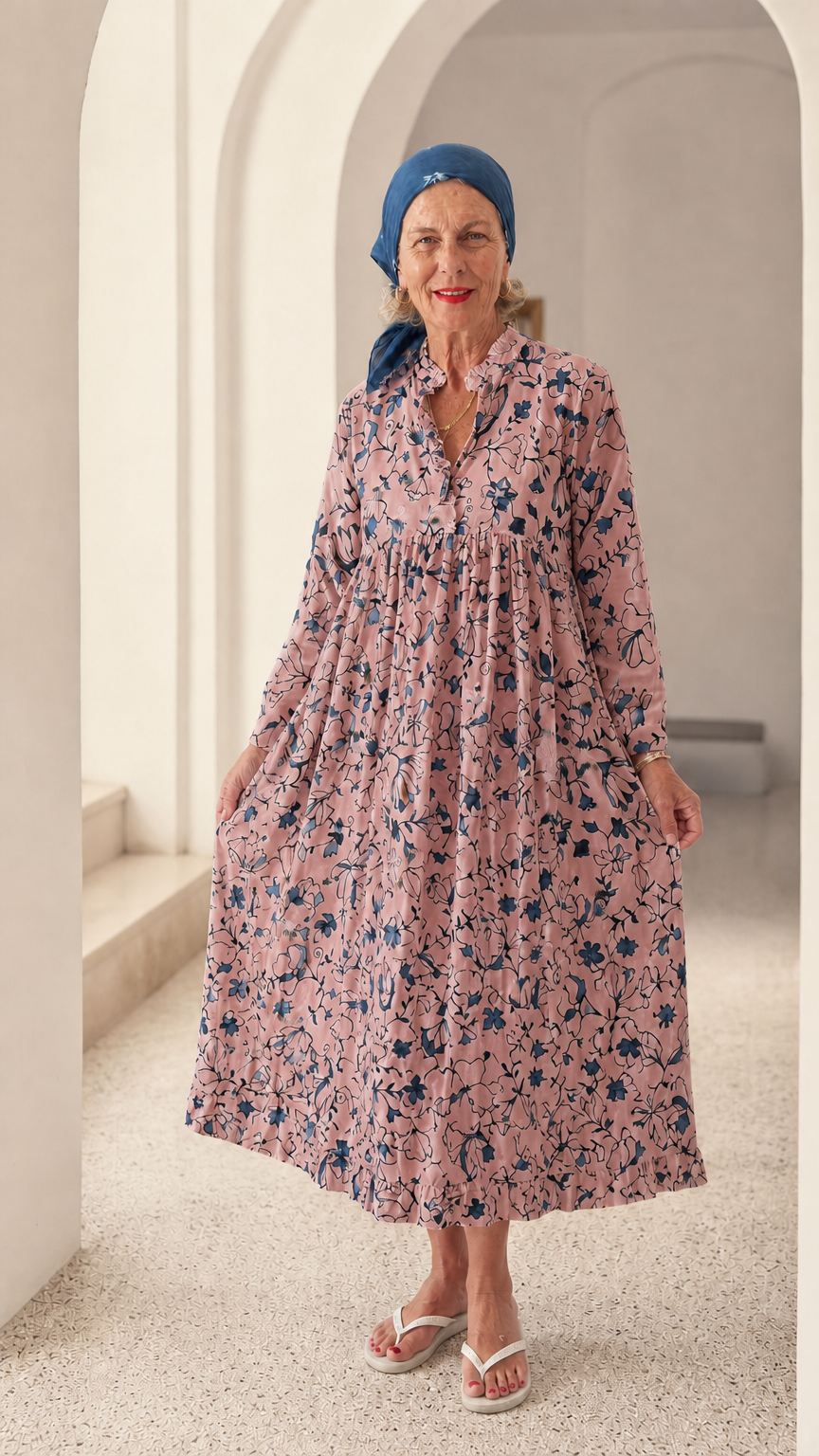 Front view of woman wearing Pink floral long sleeve relaxed smock dress