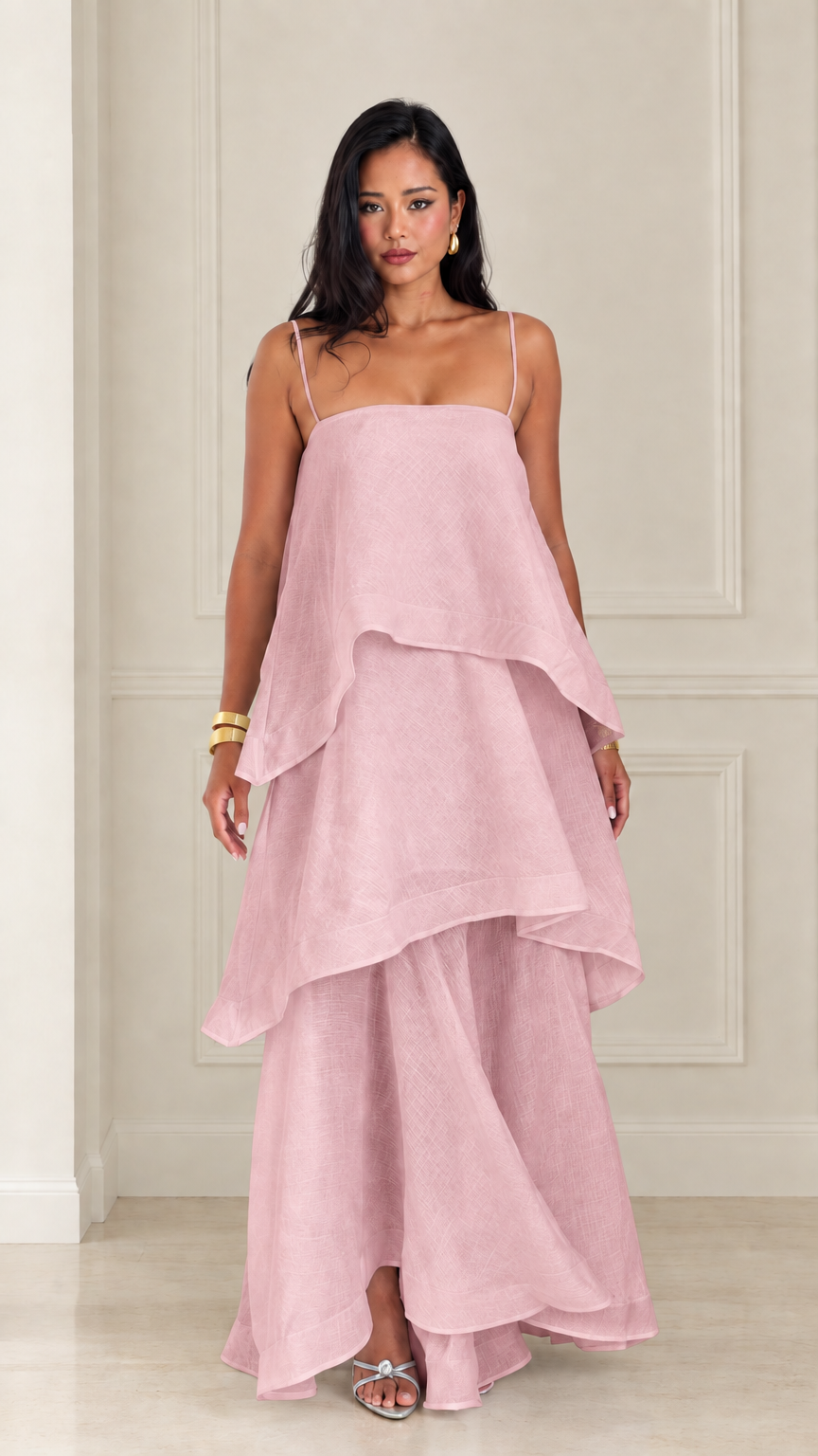 Front view of woman wearing dusty pink tiered spaghetti strap maxi dress