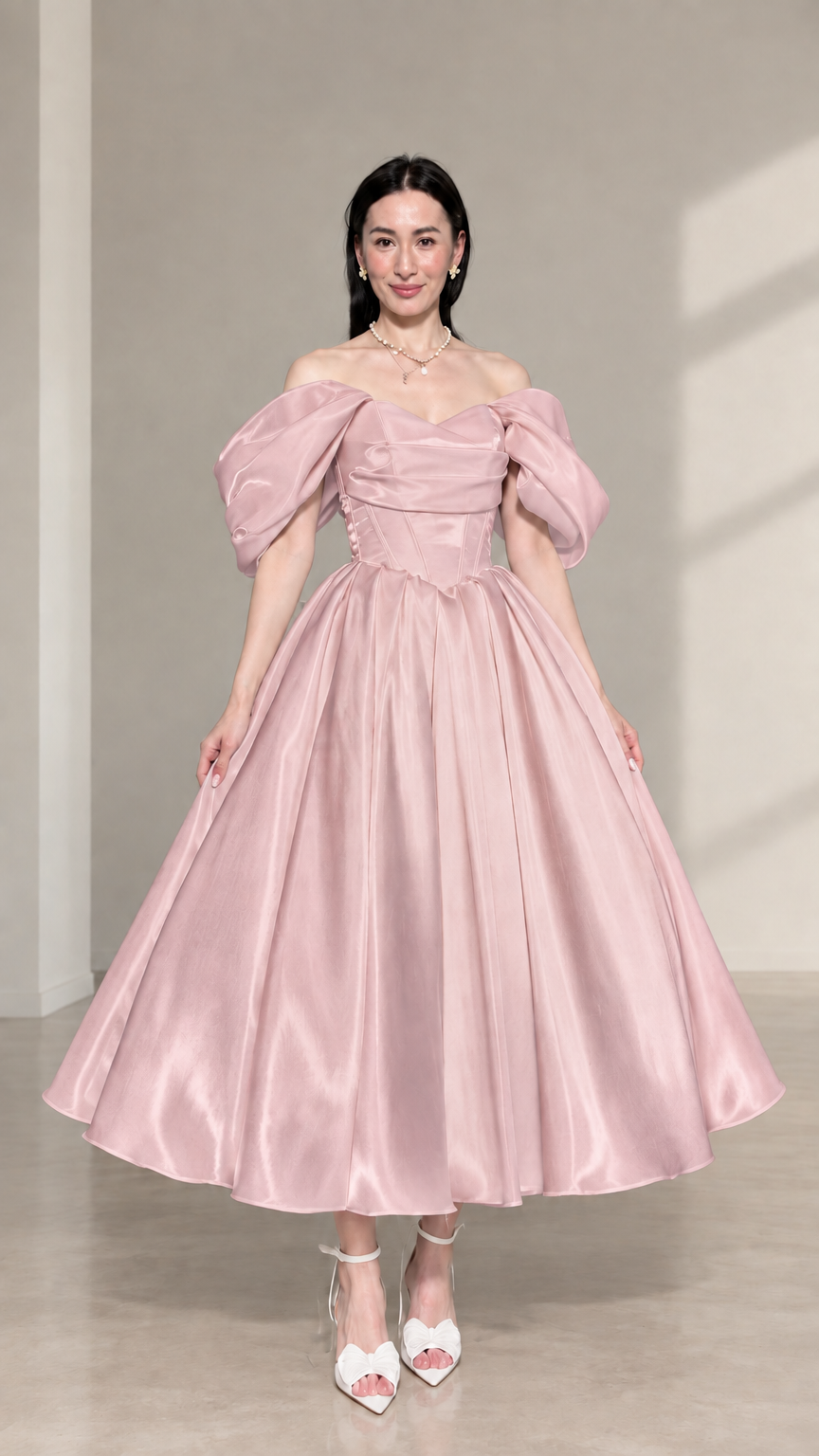 Front view of blush pink off-the-shoulder corset satin midi dress with puff sleeves