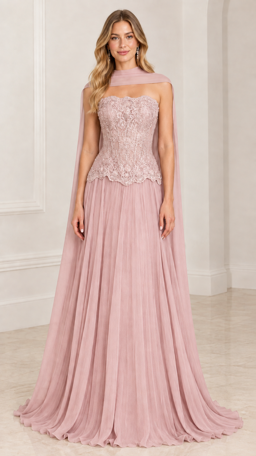 Front view of model wearing dusty rose pink strapless lace corset evening gown with chiffon cape