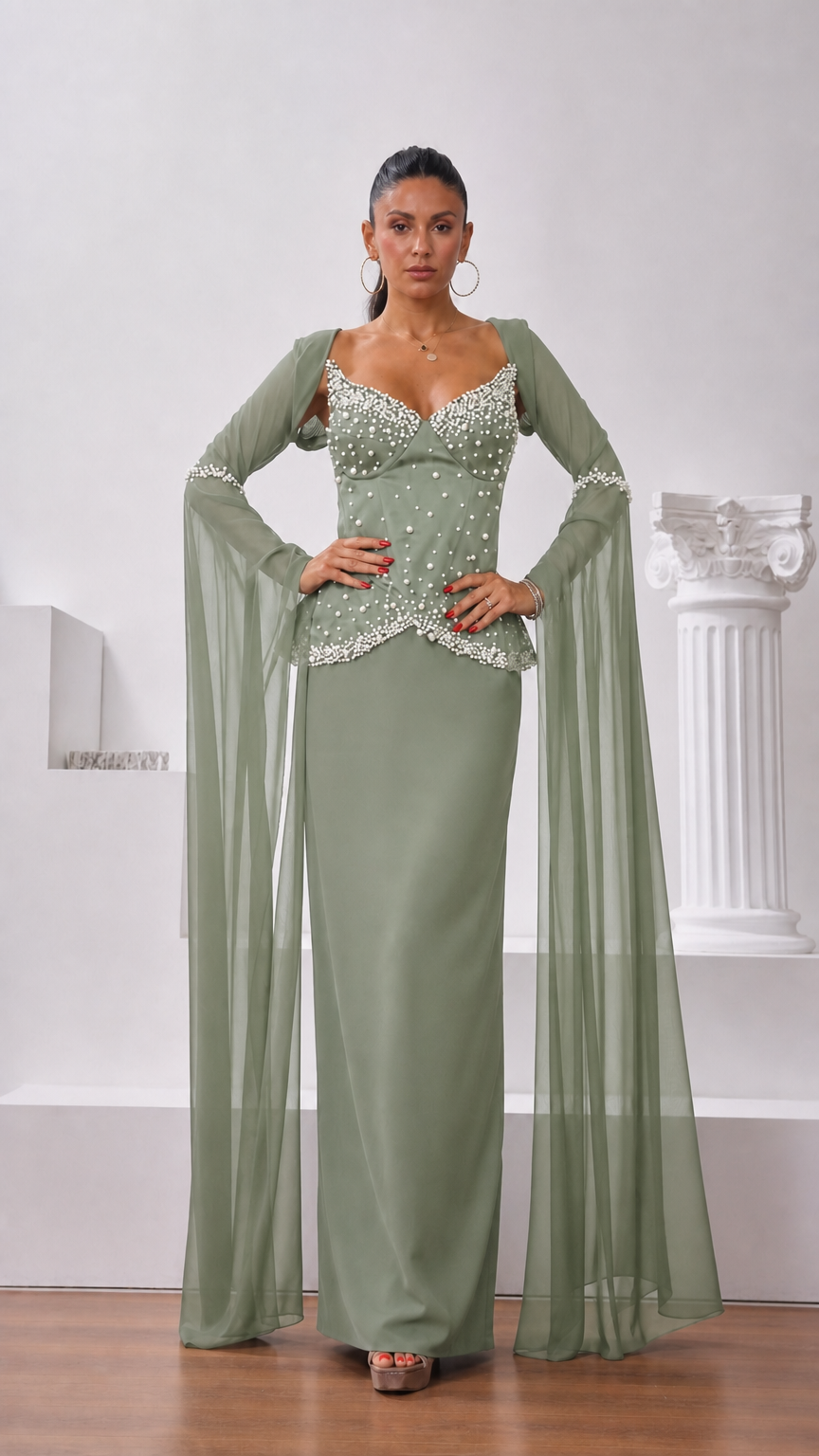 Front view of model wearing sage green pearl-embellished corset gown with floor-length chiffon sleeves