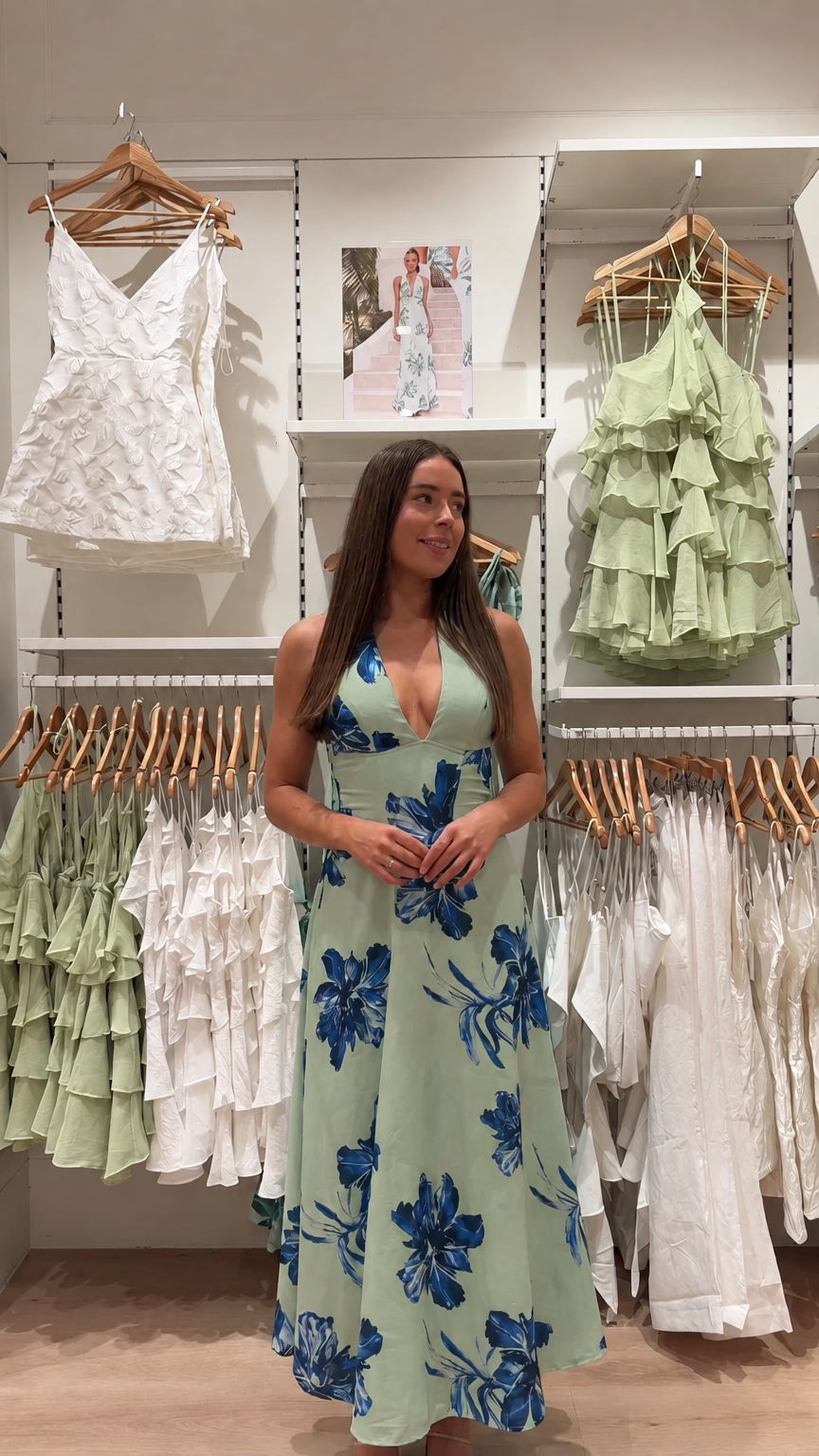 Front view of model wearing sage green floral halter neck maxi dress