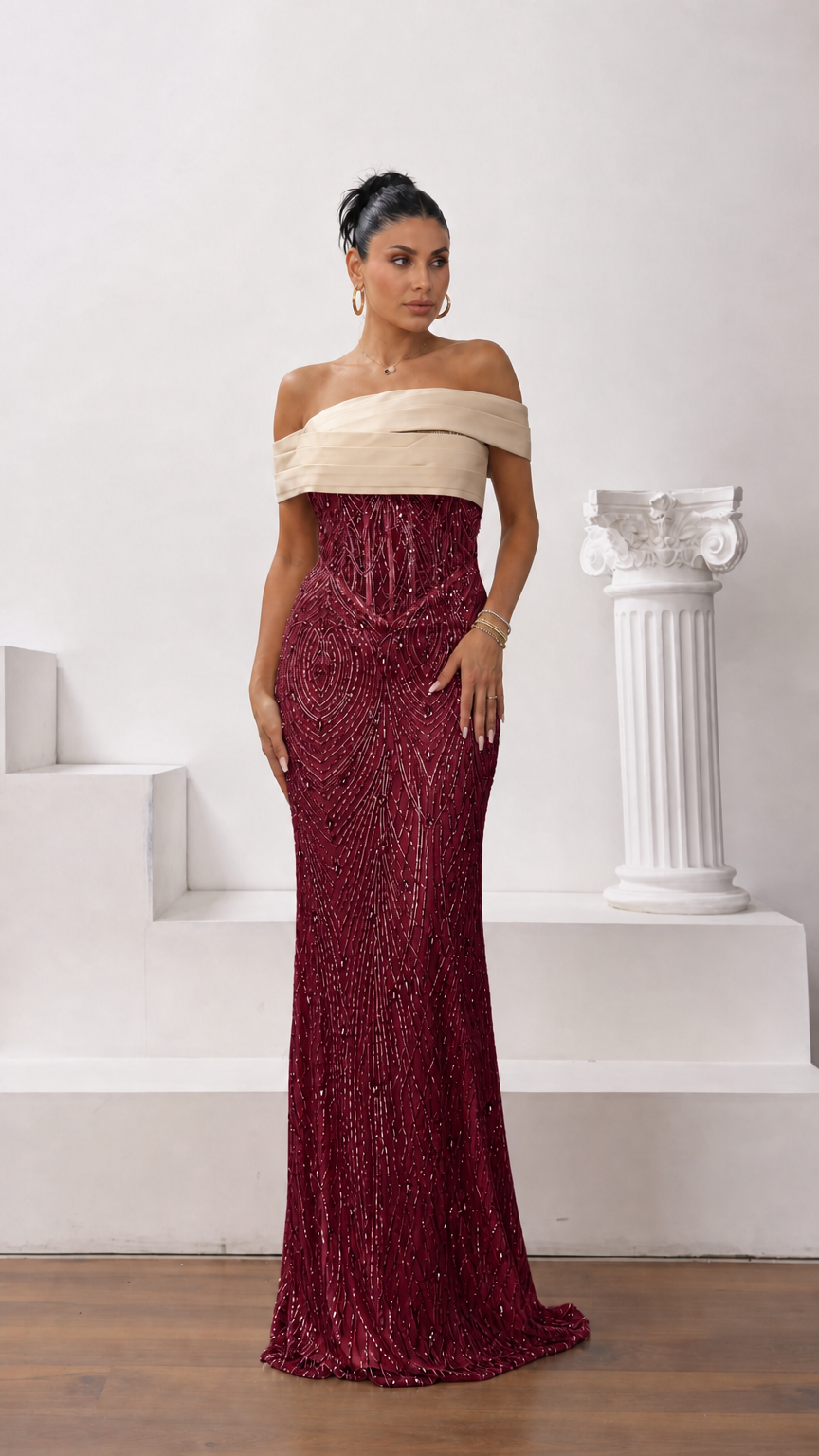 Model wearing burgundy and champagne off-the-shoulder embellished evening gown