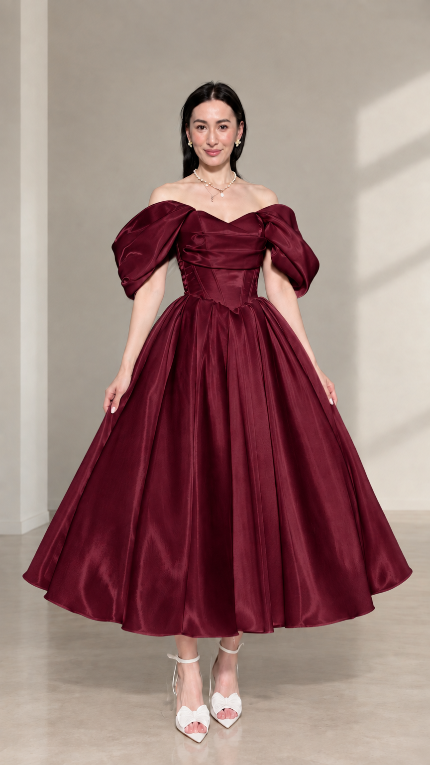 Front view of burgundy red off-the-shoulder corset satin midi dress with puff sleeves