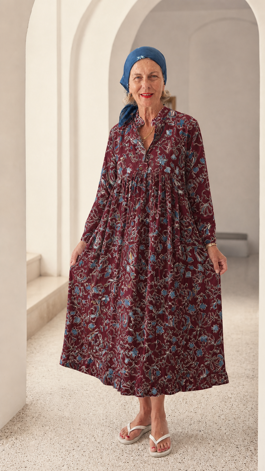 Front view of woman wearing Burgundy floral long sleeve tiered midi dress
