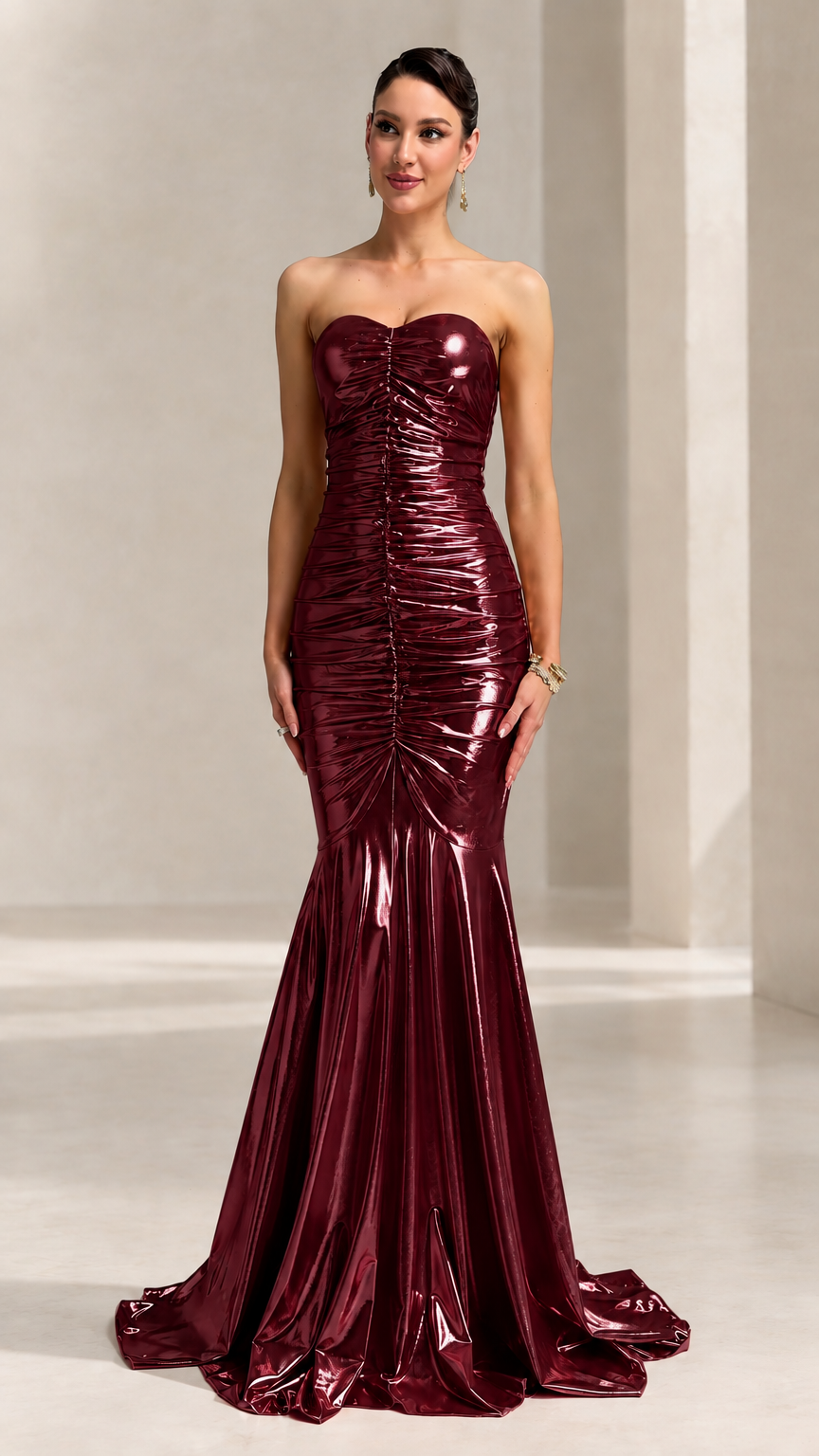 Front view of model wearing the strapless burgundy metallic ruched mermaid evening gown