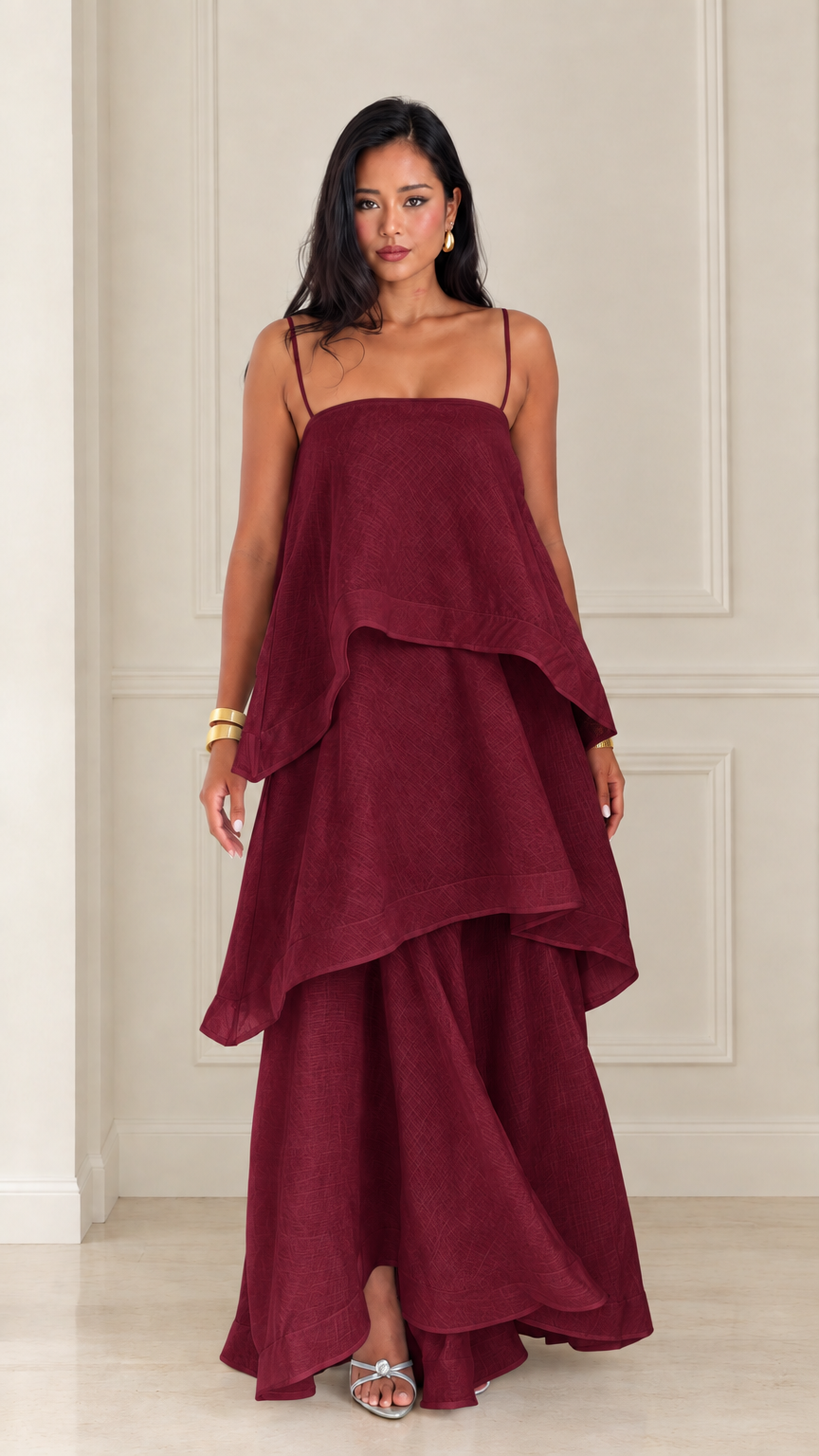Front view of woman wearing burgundy tiered spaghetti strap maxi dress