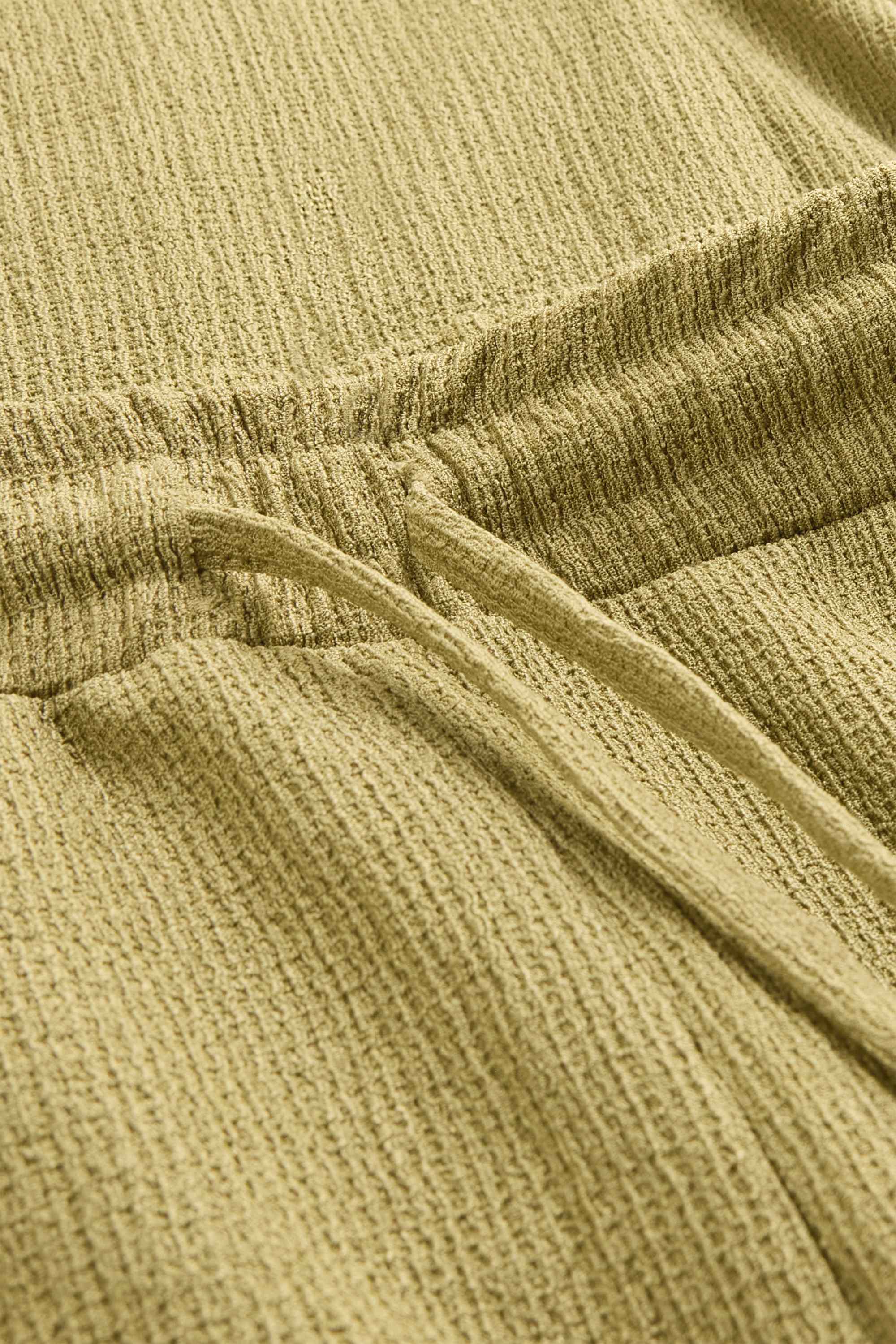 Jersey trousers - mid-rise waist - wide leg - textured light green