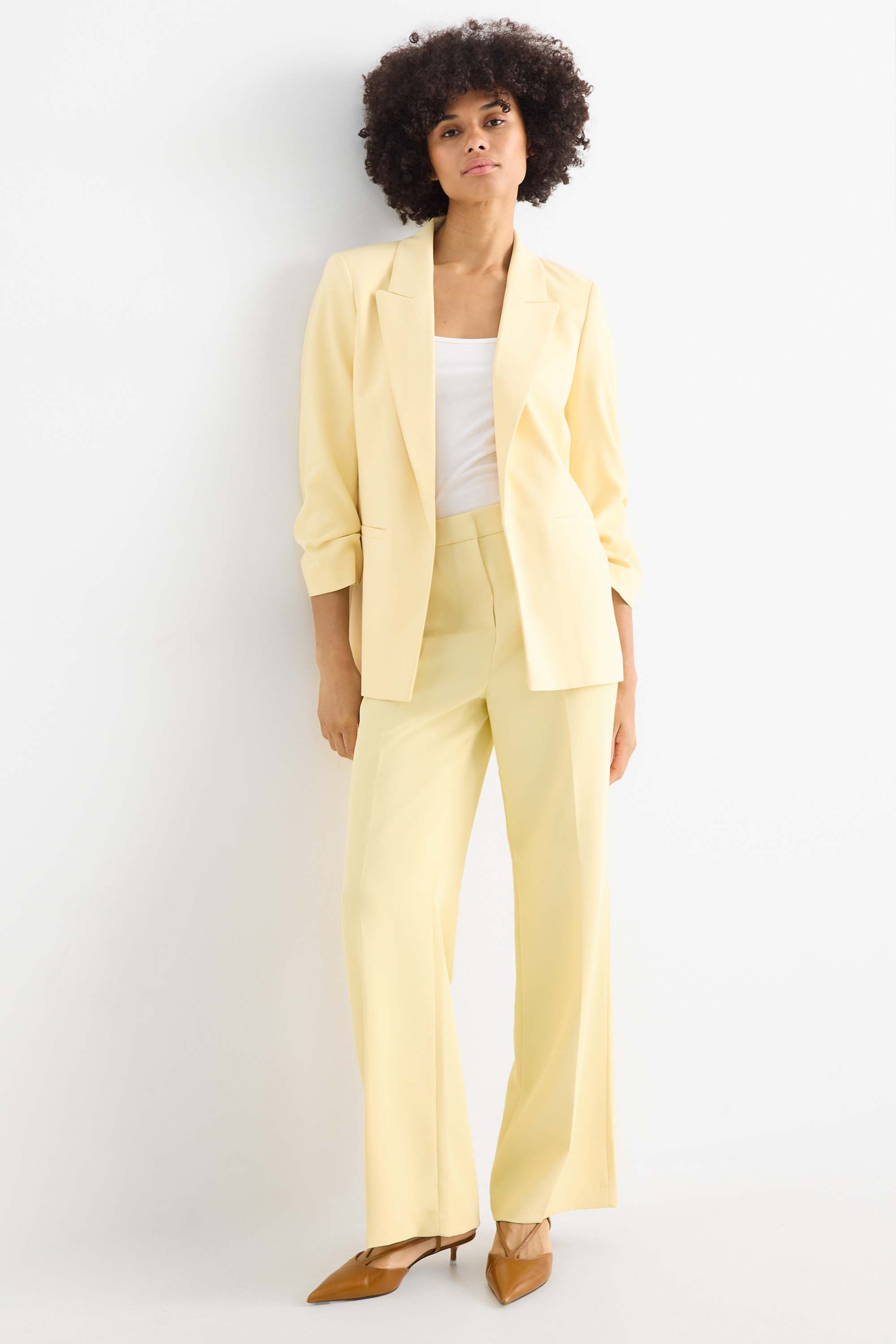 Business trousers - mid-rise waist - wide leg light yellow